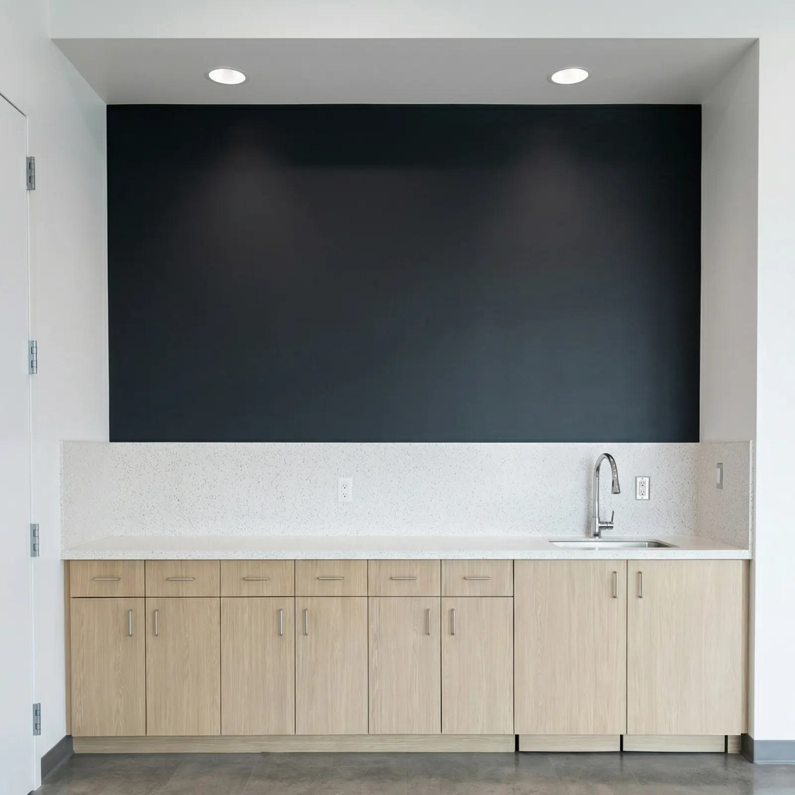 Maintenance facility countertop and sink area with Wilsonart Avalanche Melange acrylic solid surface and Formica Aged Ash HPL cabinets in Port Hueneme CA